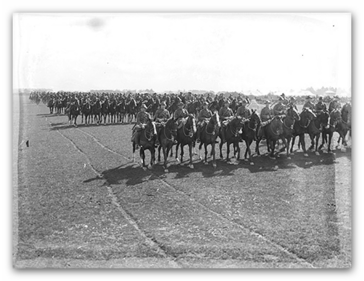The Canterbury Mounted Regiment marching past during an inspection at Sockburn Camp. Published in the Weekly Press, 23 September 1914 page 36.